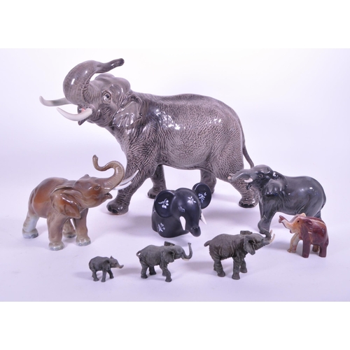 419 - Large Beswick elephant with trunk curled upwards, stamp to base of one  foot, along with a similar s... 