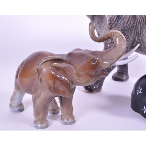 419 - Large Beswick elephant with trunk curled upwards, stamp to base of one  foot, along with a similar s... 