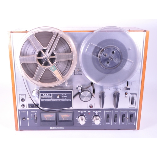 409 - Akai - A vintage 20th century Akai 4000DB three head reel to reel tape recorder. Having teak body.... 