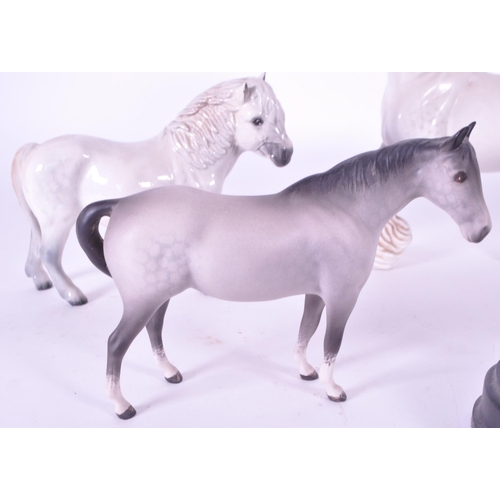 416 - Beswick / Royal Doulton - A collection of porcelain china horse figurines / statues. Including a gre... 