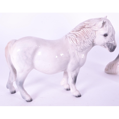416 - Beswick / Royal Doulton - A collection of porcelain china horse figurines / statues. Including a gre... 