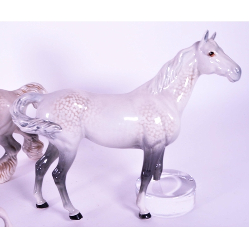 416 - Beswick / Royal Doulton - A collection of porcelain china horse figurines / statues. Including a gre... 