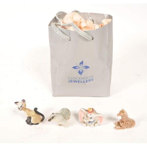 147 - Wade - Mid century Whimsies porcelain figures, the majority being of Disney interest. Examples inclu... 