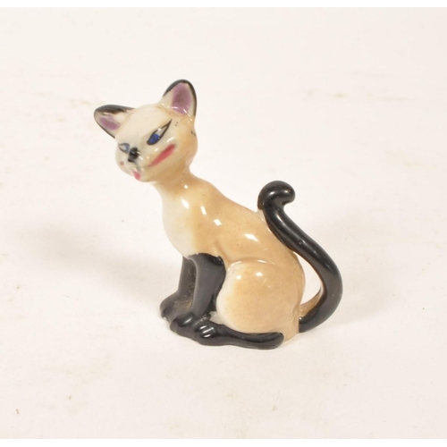 147 - Wade - Mid century Whimsies porcelain figures, the majority being of Disney interest. Examples inclu... 