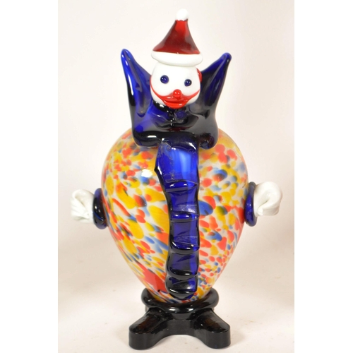 161 - Collection of four Murano style studio glass clown figures. Including a Daysun decanter in a red and... 
