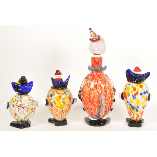 161 - Collection of four Murano style studio glass clown figures. Including a Daysun decanter in a red and... 