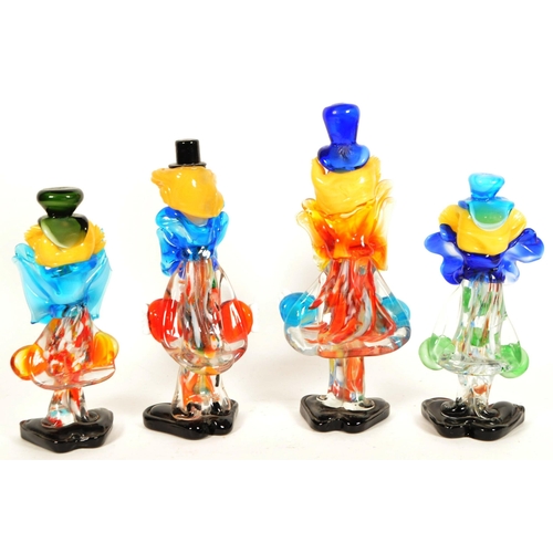 168 - Four mid century Murano style studio glass clown figures. Multicoloured, all featured wearing oversi... 