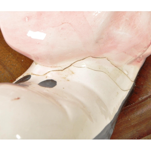 172 - Two large late 20th century vintage ceramic clown figures. Comprised of one positioned holding a bal... 