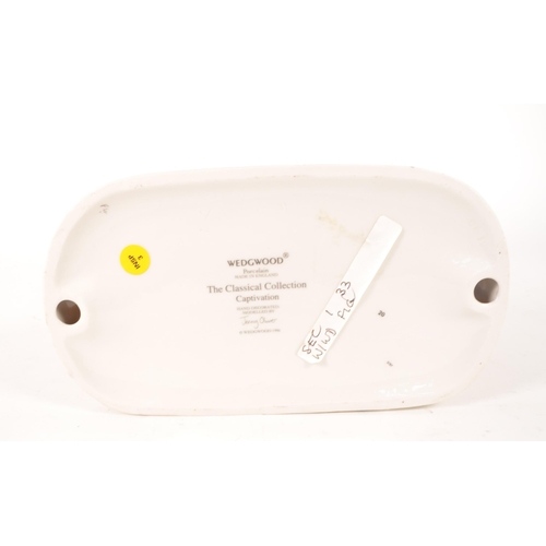 12 - Wedgwood - 1996 porcelain classical figure titled Captivation from the Classical Collection series. ... 