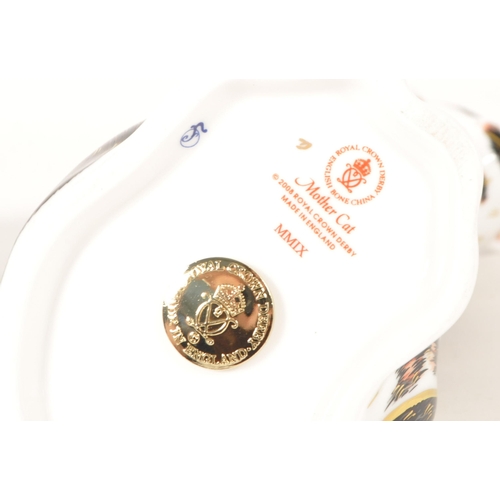 15 - Royal Crown Derby - Two 21st century bone china cat figures. Comprised of a 2008 Mother Cat numbered... 