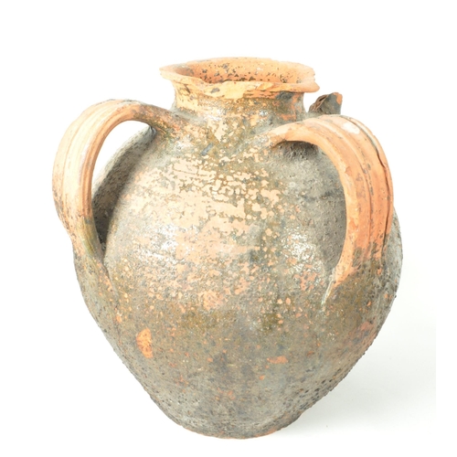 17 - Two 20th century terracotta earthernware pottery garden plant urns / vases. Comprised of a four hand... 