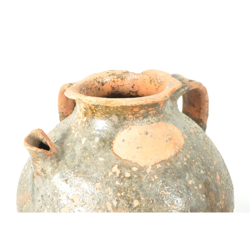 17 - Two 20th century terracotta earthernware pottery garden plant urns / vases. Comprised of a four hand... 