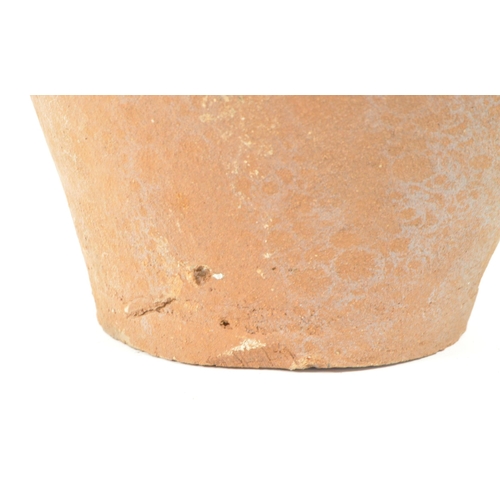 17 - Two 20th century terracotta earthernware pottery garden plant urns / vases. Comprised of a four hand... 