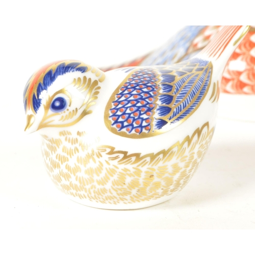 27 - Royal Crown Derby - Four 21st century bone china bird paperweight figures. Comprised of a pheasant n... 