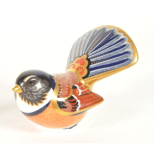 27 - Royal Crown Derby - Four 21st century bone china bird paperweight figures. Comprised of a pheasant n... 