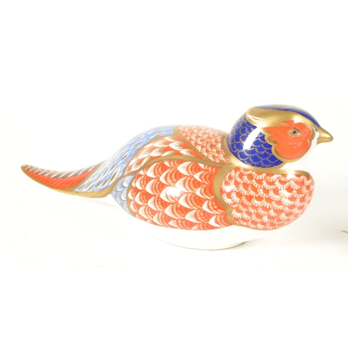 27 - Royal Crown Derby - Four 21st century bone china bird paperweight figures. Comprised of a pheasant n... 