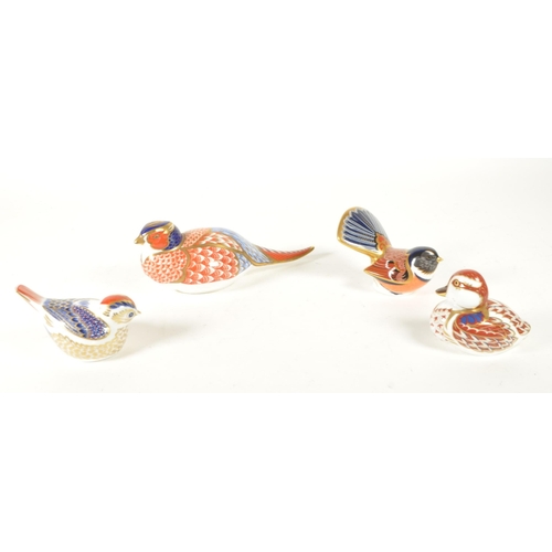 27 - Royal Crown Derby - Four 21st century bone china bird paperweight figures. Comprised of a pheasant n... 