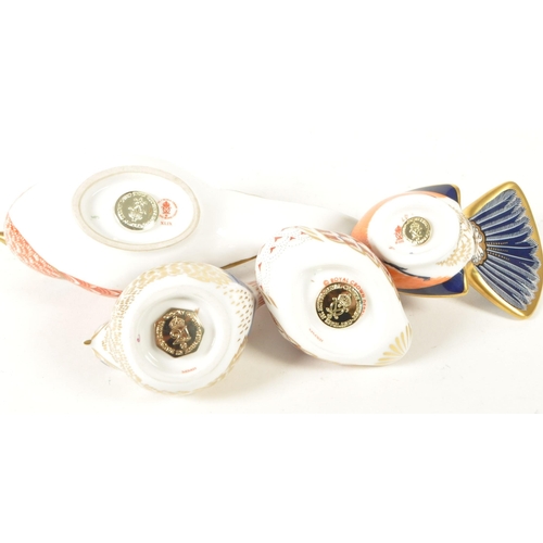 27 - Royal Crown Derby - Four 21st century bone china bird paperweight figures. Comprised of a pheasant n... 