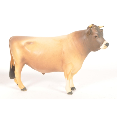 33 - Beswick - Two vintage 20th century Beswick china cow figures. The collection to include two No. 1422... 