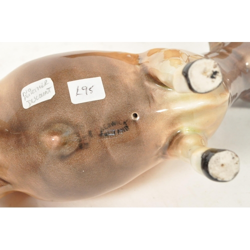 33 - Beswick - Two vintage 20th century Beswick china cow figures. The collection to include two No. 1422... 