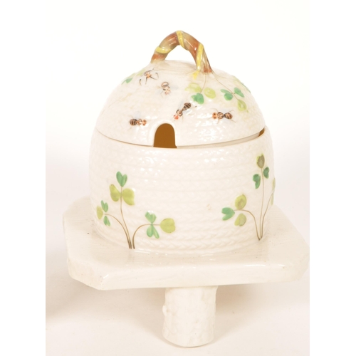40 - Belleek / Bizarre by Clarice Cliff - A vintage 20th century Irish porcelain beehive honey pot on sta... 