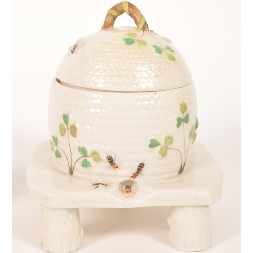 40 - Belleek / Bizarre by Clarice Cliff - A vintage 20th century Irish porcelain beehive honey pot on sta... 