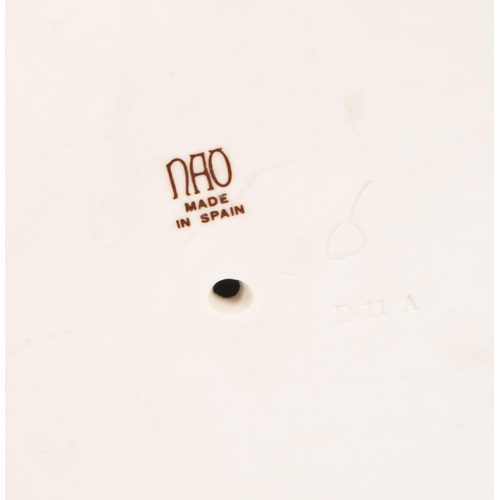 45 - Late 20th century Lladro porcelain 'Little Girl' bust numbered 1202 with a Nao porcelain 'Girl at We... 