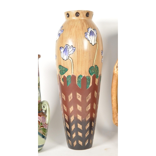 47 - Four 20th century pottery vases. Comprised of an early 20th century Bretby twin handled vase, model ... 
