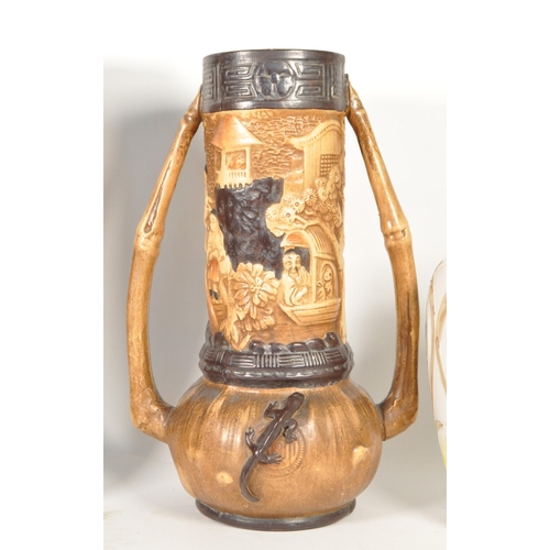 47 - Four 20th century pottery vases. Comprised of an early 20th century Bretby twin handled vase, model ... 