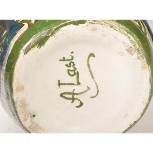 47 - Four 20th century pottery vases. Comprised of an early 20th century Bretby twin handled vase, model ... 