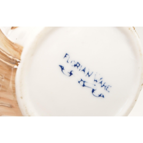 47 - Four 20th century pottery vases. Comprised of an early 20th century Bretby twin handled vase, model ... 