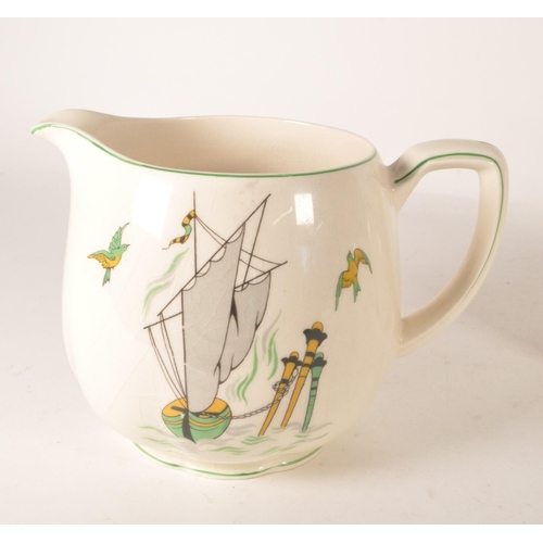 49 - New Hall Pottery - Three graduating mid century 1950s earthenware Staffordshire jugs. Each decorated... 