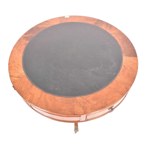 A late Victorian 19th century flame mahogany drum rent table. The table ...