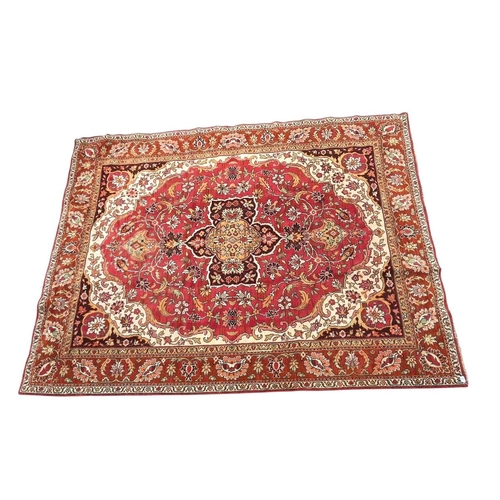 A 20th century Persian Islamic hand woven wool floor carpet rug. The ...
