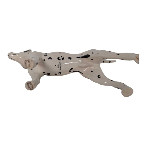 115 - Beswick - A collection of vintage 20th century Dalmatian dog porcelain figures. Including mum, dad a... 