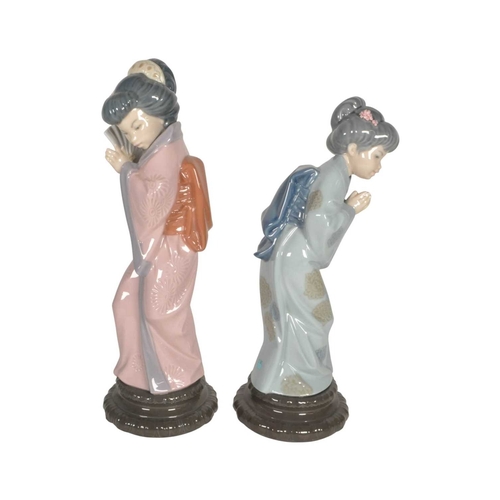 13 - Lladro - Two late 20th century porcelain Japanese Geisha lady figures. Comprised of no. 4990 'Japone... 