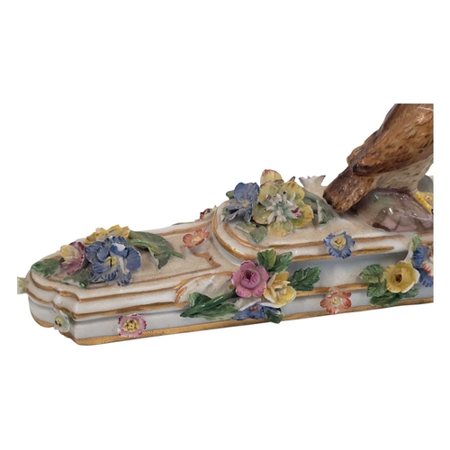 131 - Meissen, Germany - An 18th century porcelain china figure / ornament. Having an owl figure to top on... 