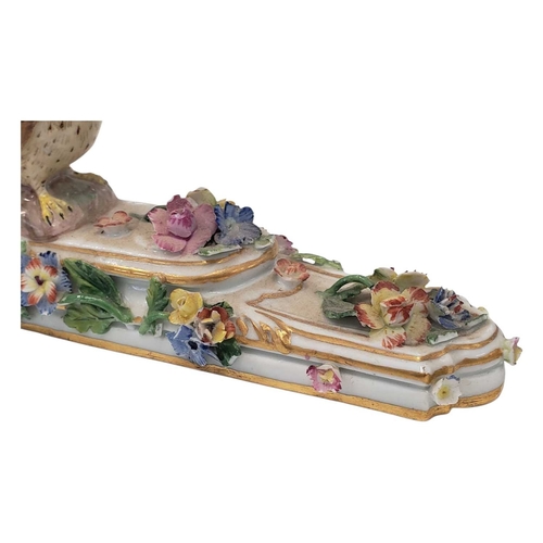 131 - Meissen, Germany - An 18th century porcelain china figure / ornament. Having an owl figure to top on... 