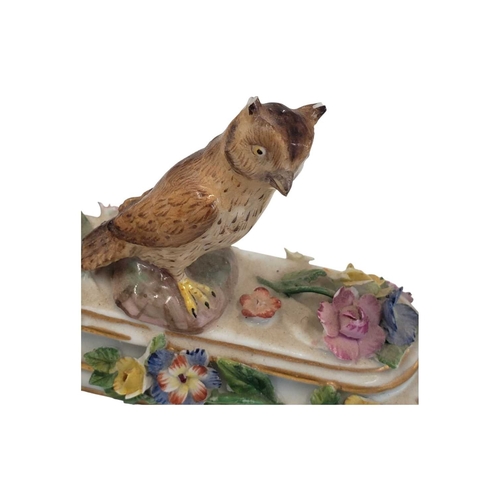 131 - Meissen, Germany - An 18th century porcelain china figure / ornament. Having an owl figure to top on... 