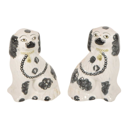135 - Pair of 19th century Staffordshire ceramic fire side mantel dogs. In a seating position on a white g... 