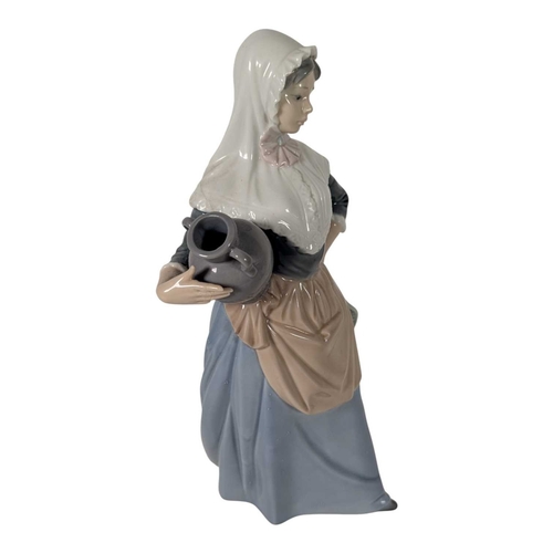 140 - Lladro / Nao - Two vintage 20th century Spanish porcelain figures. The collection to include Nao by ... 