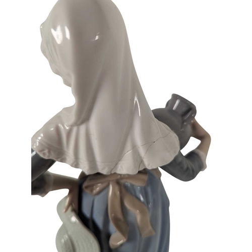 140 - Lladro / Nao - Two vintage 20th century Spanish porcelain figures. The collection to include Nao by ... 