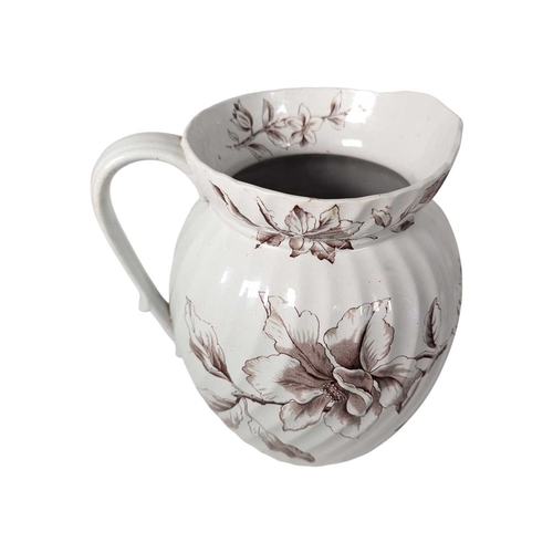 144 - A late 19th / 20th century ironstone and stoneware household pieces. Comprising a Doulton Lambeth tw... 