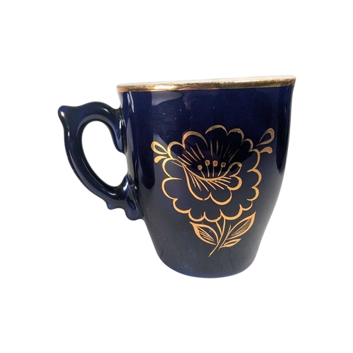 16 - A pair of 20th century cobalt blue vintage Soviet Dovbysh style porcelain cups / mugs. Decorated wit... 