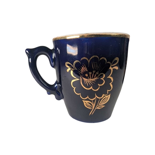 16 - A pair of 20th century cobalt blue vintage Soviet Dovbysh style porcelain cups / mugs. Decorated wit... 