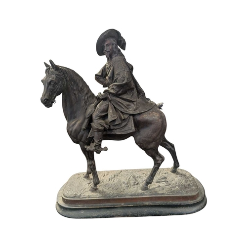 173 - Two early 20th century bronzed spelter sculptures of cavalier figures on horseback. Both raised on w... 