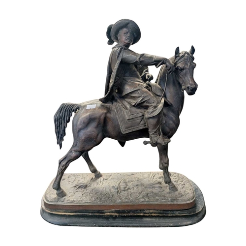 173 - Two early 20th century bronzed spelter sculptures of cavalier figures on horseback. Both raised on w... 