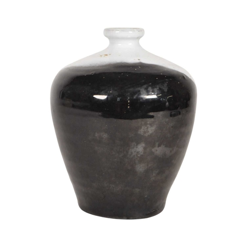 24 - Late 20th century studio pottery drip glaze vase. Of ovoid form with a black and white two tone drip... 