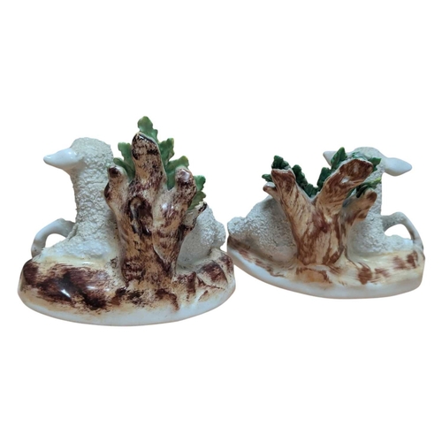 3 - A pair of 18th century Chelsea porcelain china sheep figures. Reclining position with floral / folia... 
