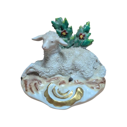 3 - A pair of 18th century Chelsea porcelain china sheep figures. Reclining position with floral / folia... 